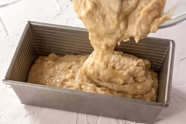 Pouring batter into bread pan